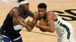 Jarred Vanderbilt of Timberwolves (left) tries to stop Giannis Antetokounmpo