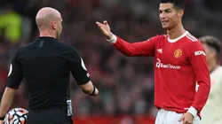 Cristiano Ronaldo of Manchester United (right) interacts with referee Anthony Taylor (left)