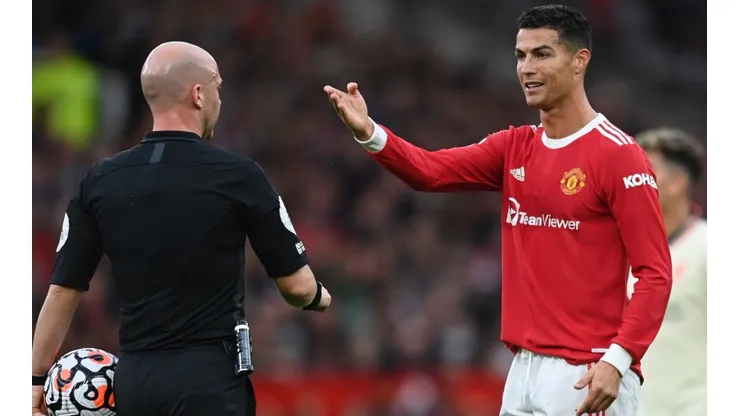 Cristiano Ronaldo of Manchester United (right) interacts with referee Anthony Taylor (left)