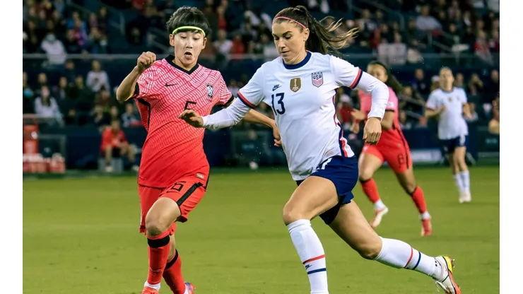 Lim Seonjoo #6 of Korea Republic fends off Alex Morgan #13 of United States