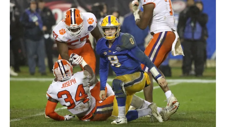 Kenny Pickett (front, blue and yellow uniform) during his game lost to the Clemson Tigers in the 2018 ACC Championship