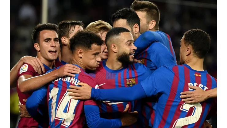 Barcelona players celebrate after scoring a goal