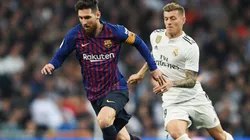 Lionel Messi and Toni Kroos in action during a Barcelona v Real Madrid El Clasico derby in 2019.