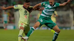 Roger Martinez of Club America (left) fights for ball control with Matheus Doria of Santos Laguna