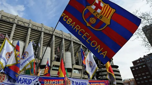 An FC Barcelona flag flies at a merchandise stall.