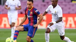 Sergino Dest of Barcelona battles for possession with Vinicius Junior of Real Madrid