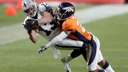 Hunter Renfrow of the Raiders (left) tries to gain more yards against Will Parks of the Broncos by Matthew Stockman