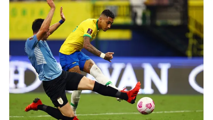 Raphinha of Brazil scores against Uruguay.