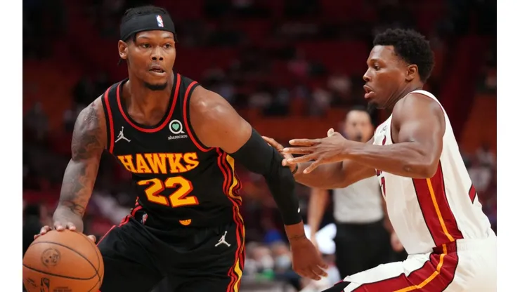 Cam Reddish of the Atlanta Hawks (left) and Kyle Lowry of the Miami Heat (right)