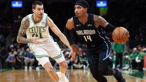 Juancho Hernangomez of Boston Celtics (left) tries to block Gary Harris of Orlando Magic
