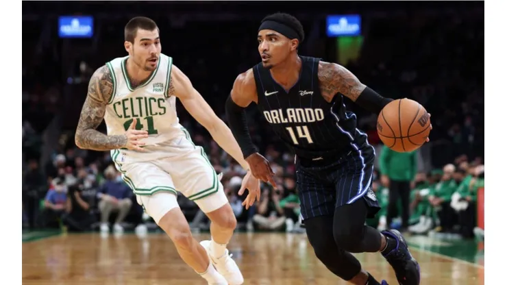 Juancho Hernangomez of Boston Celtics (left) tries to block Gary Harris of Orlando Magic
