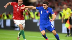 Adam Szalai of Hungary (left) fights for ball control against Harry Maguire of England
