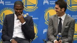 Kevin Durant in his presentation as the Golden State Warriors' new signing alongside GM Bob Myers in 2016.