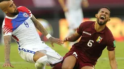 Arturo Vidal of Chile (left) after a illegal fault against Yangel Herrera of Venezuela