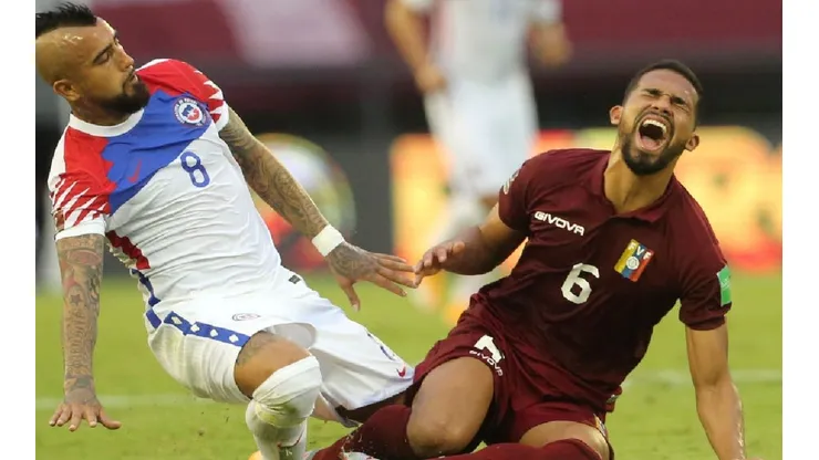 Arturo Vidal of Chile (left) after a illegal fault against Yangel Herrera of Venezuela