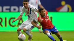 Paraguay's Miguel Almiron (left) struggles for the ball with Chile's Charles Aranguiz.