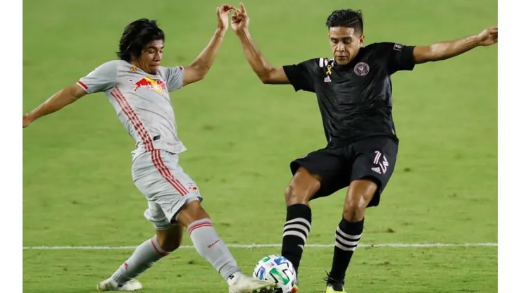 Omir Fernandez of New York Red Bulls (left) fights for ball control against Victor Ulloa of Inter Miami