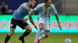 Argentina's Angel Di Maria (right) fights for the ball with Uruguay's Nahitan Nandez