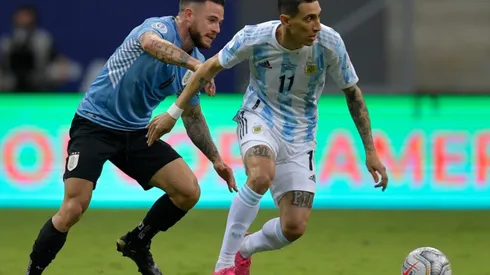Argentina's Angel Di Maria (right) fights for the ball with Uruguay's Nahitan Nandez