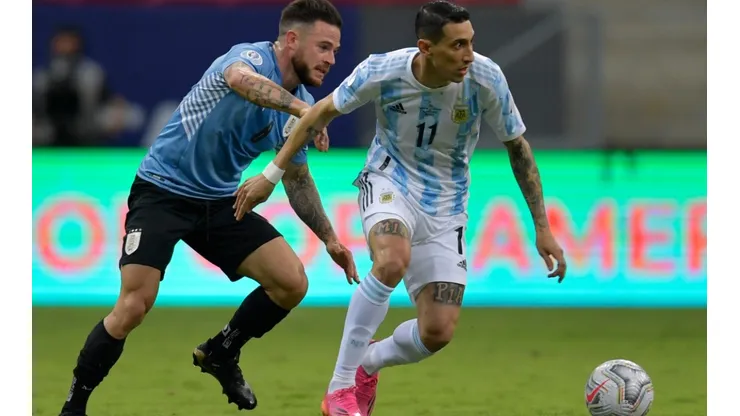 Argentina's Angel Di Maria (right) fights for the ball with Uruguay's Nahitan Nandez