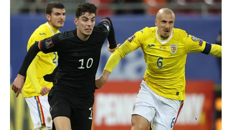 Kai Havertz of Germany (left) and Vlad Chiriches of Romania (right)