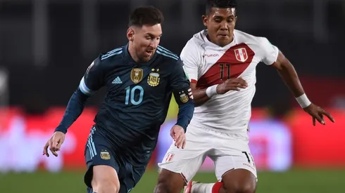Lionel Messi against Raziel Garcia during Argentina's win over Peru.