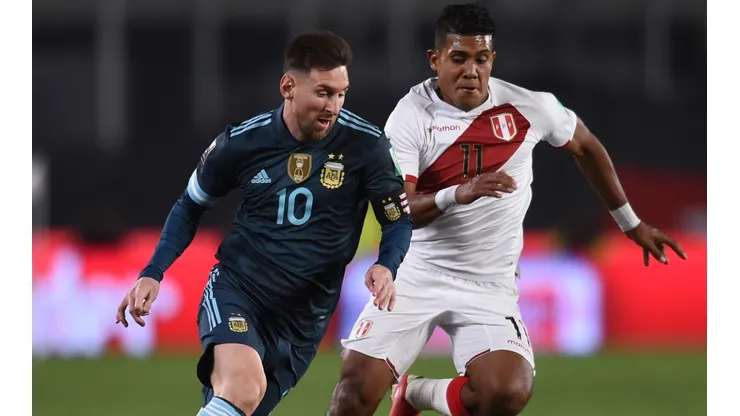 Lionel Messi against Raziel Garcia during Argentina's win over Peru.