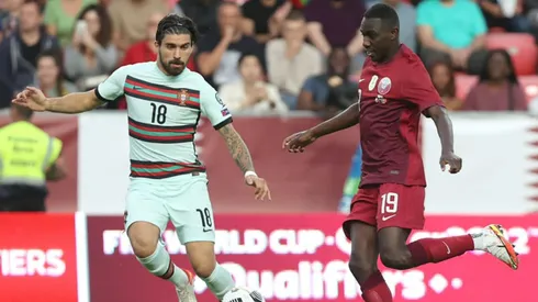 Ruben Neves of Portugal (left) and Ali Almoez of Qatar (left)