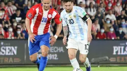 Lionel Messi of Argentina fights for the ball with Jorge Morel of Paraguay.