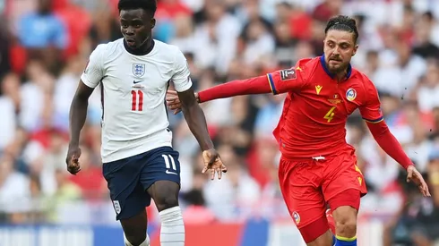 Bukayo Saka of England (left) is put under pressure by Marc Rebes of Andorra (right)