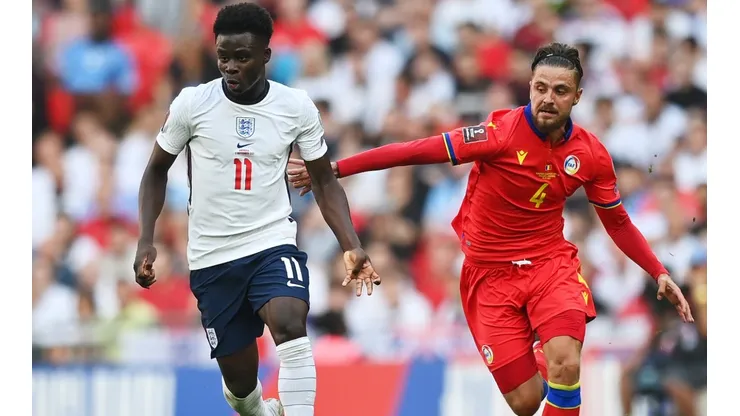 Bukayo Saka of England (left) is put under pressure by Marc Rebes of Andorra (right)