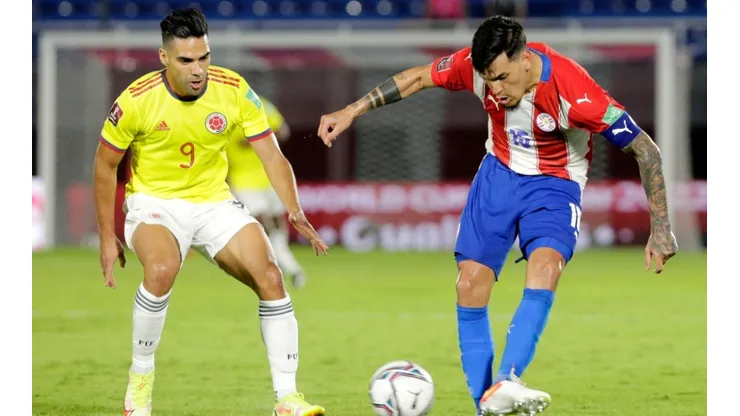 Gustavo Gomez of Paraguay kicks the ball against Radamel Falcao of Colombia