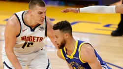 Nikola Jokic of the Denver Nuggets against Stephen Curry of the Golden State Warriors.