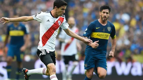 Ignacio Fernandez of River against Pablo Perez of Boca in the first leg of the 2018 Copa Libertadores final at La Bombonera.