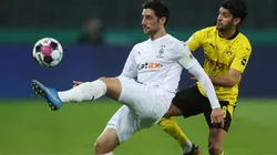 Lars Stindi of Monchengladbach (left) fight for ball control with Mahmoud Dahoud of Dortmund (right)
