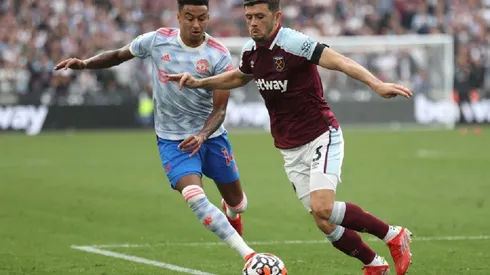 Jesse Lingard of Manchester United (left) and Aaron Cresswell of West Ham (right)