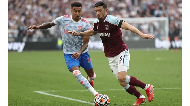 Jesse Lingard of Manchester United (left) and Aaron Cresswell of West Ham (right)