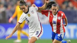 Kelley O'Hara of United States (left) and Ramona Martinez of Paraguay (right)
