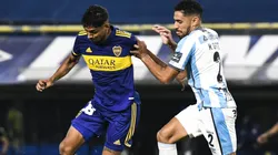 Cristian Medina of Boca Juniors against Marcelo Ortiz of Atletico Tucuman.