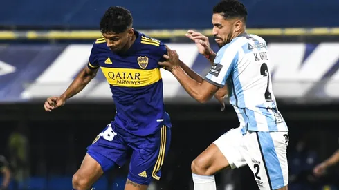 Cristian Medina of Boca Juniors against Marcelo Ortiz of Atletico Tucuman.