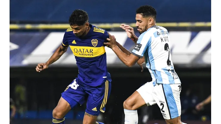 Cristian Medina of Boca Juniors against Marcelo Ortiz of Atletico Tucuman.