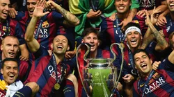 Barcelona players including Javier Mascherano, Lionel Messi, Neymar and Luis Suarez celebrate victory with the trophy after the UEFA Champions League Final between Juventus and FC Barcelona (Getty Images).