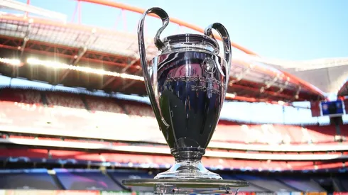 The UEFA Champions League Trophy is seen on the pitch. (Getty)