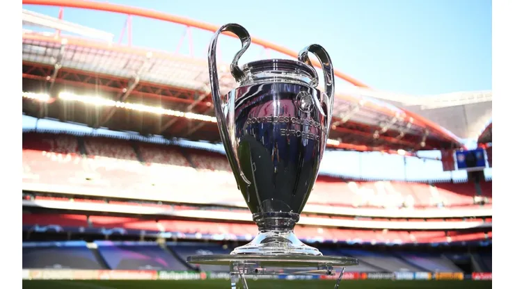The UEFA Champions League Trophy is seen on the pitch. (Getty)