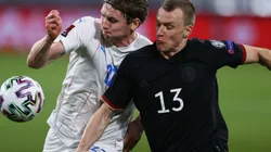 Jon Dadi Bodvarsson of Iceland (left) fights for ball control against Lukas Klostermann of Germany (right) (Getty)