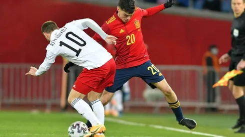 Otar Kiteishvili of Georgia (left) fights for ball control with Pedri of Spain (right) (Getty)