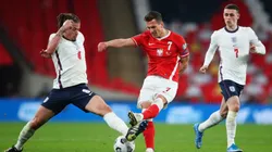 Kalvin Phillips of England (left) fights for ball control against Arkadiusz Milik of Poland (middle) (Getty)