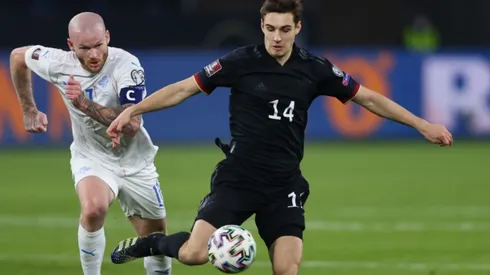 Aron Gunnarsson of Iceland (left) tries to block Florian Neuhaus of Germany (right) (Getty)