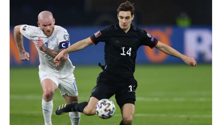 Aron Gunnarsson of Iceland (left) tries to block Florian Neuhaus of Germany (right) (Getty)