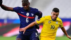 Paul Pogba of France (left) battles for possession with Junior Moraes of Ukraine (right). (Getty)